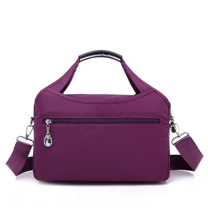 VaultChic Elegant Anti-Theft Tote Bag - close-up of branded logo and quality stitching